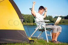 3470660-56917-young-man-with-laptop-near-the-tent.jpg